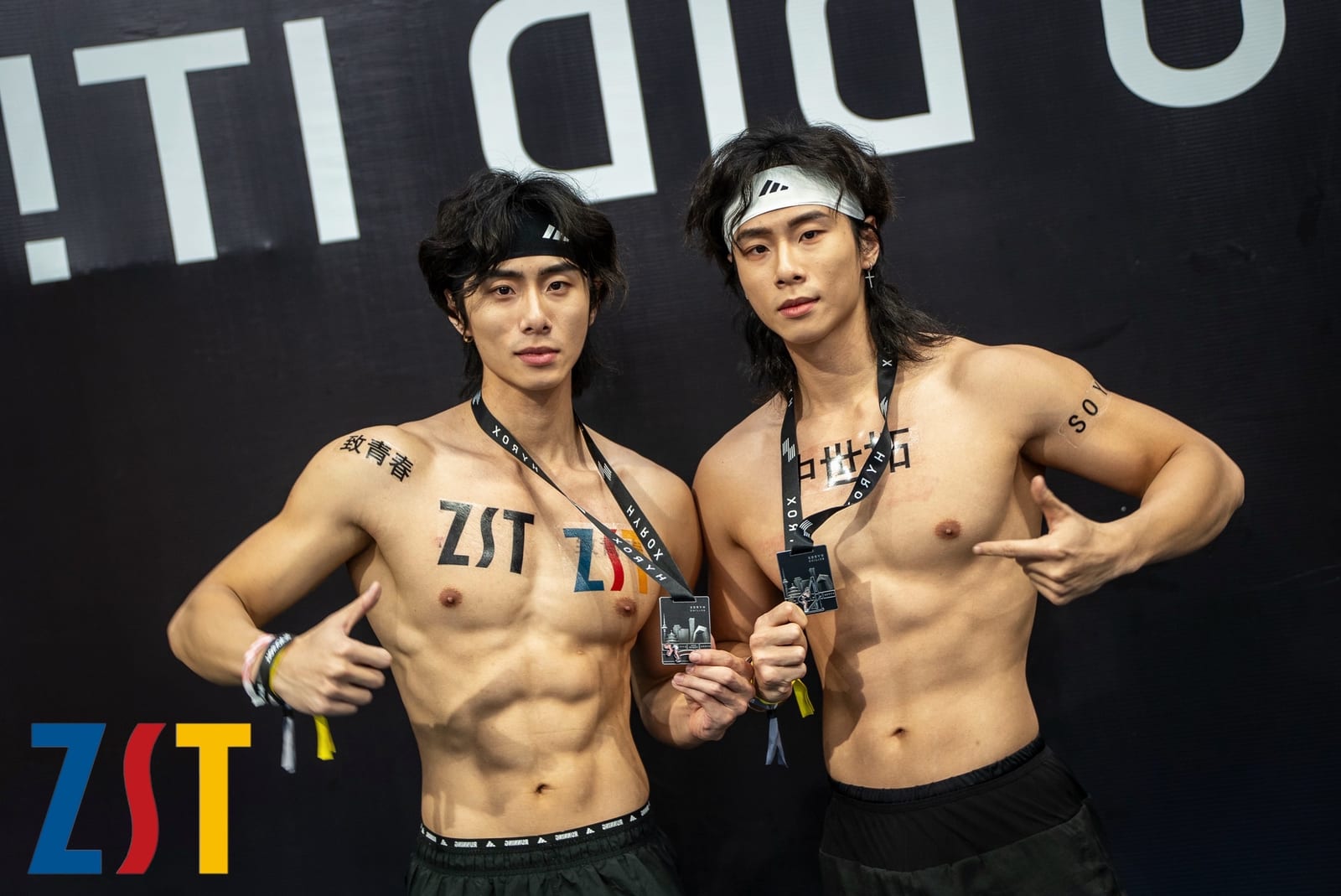 Athletes at HYROX Beijing wearing medals and ZST water-transfer tattoos