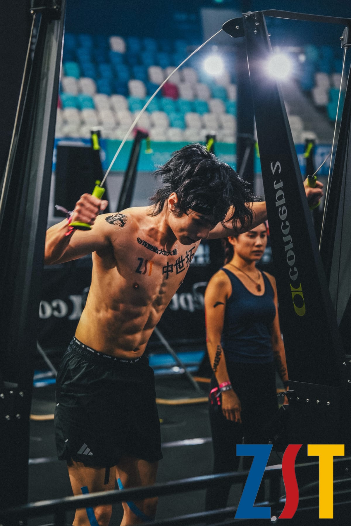 An athlete wearing a ZST water-transfer tattoo during a station at HYROX Beijing